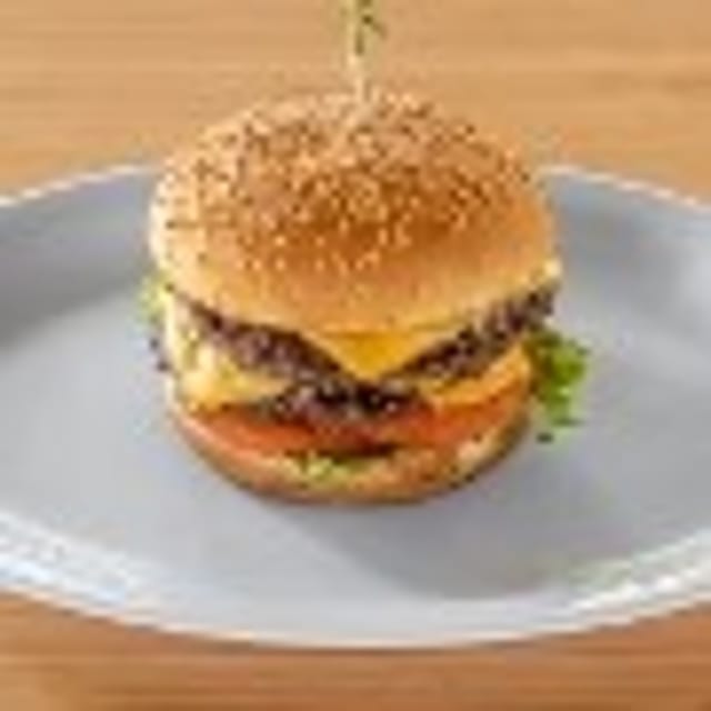 Double Cheeseburger with Fries and Soda Can.